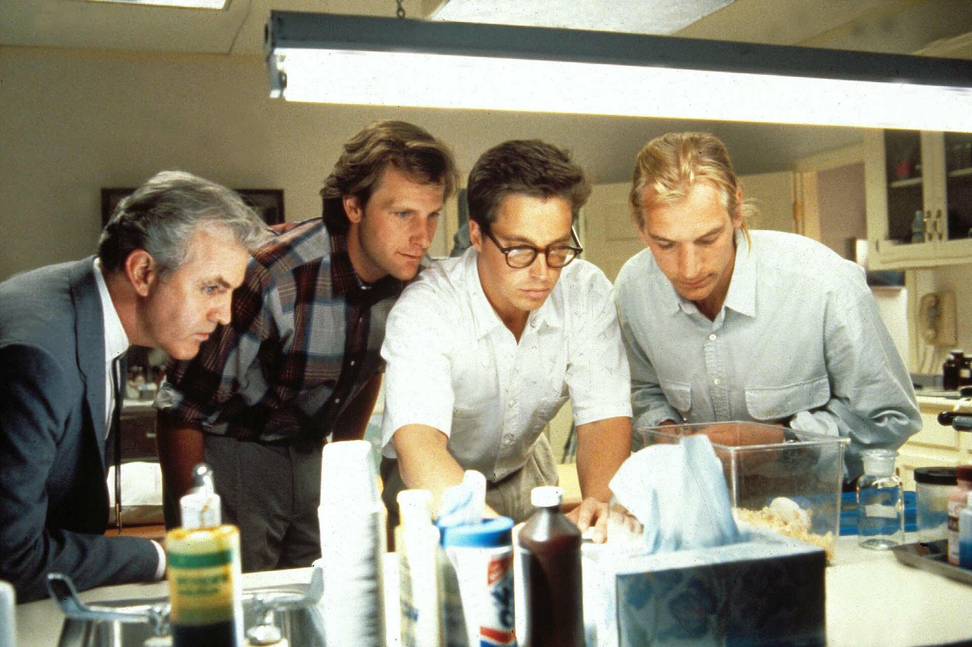 Film still from "Arachnophobia" starring Jeff Daniels, Brian Mcnamara, Julian Sands in a lab.