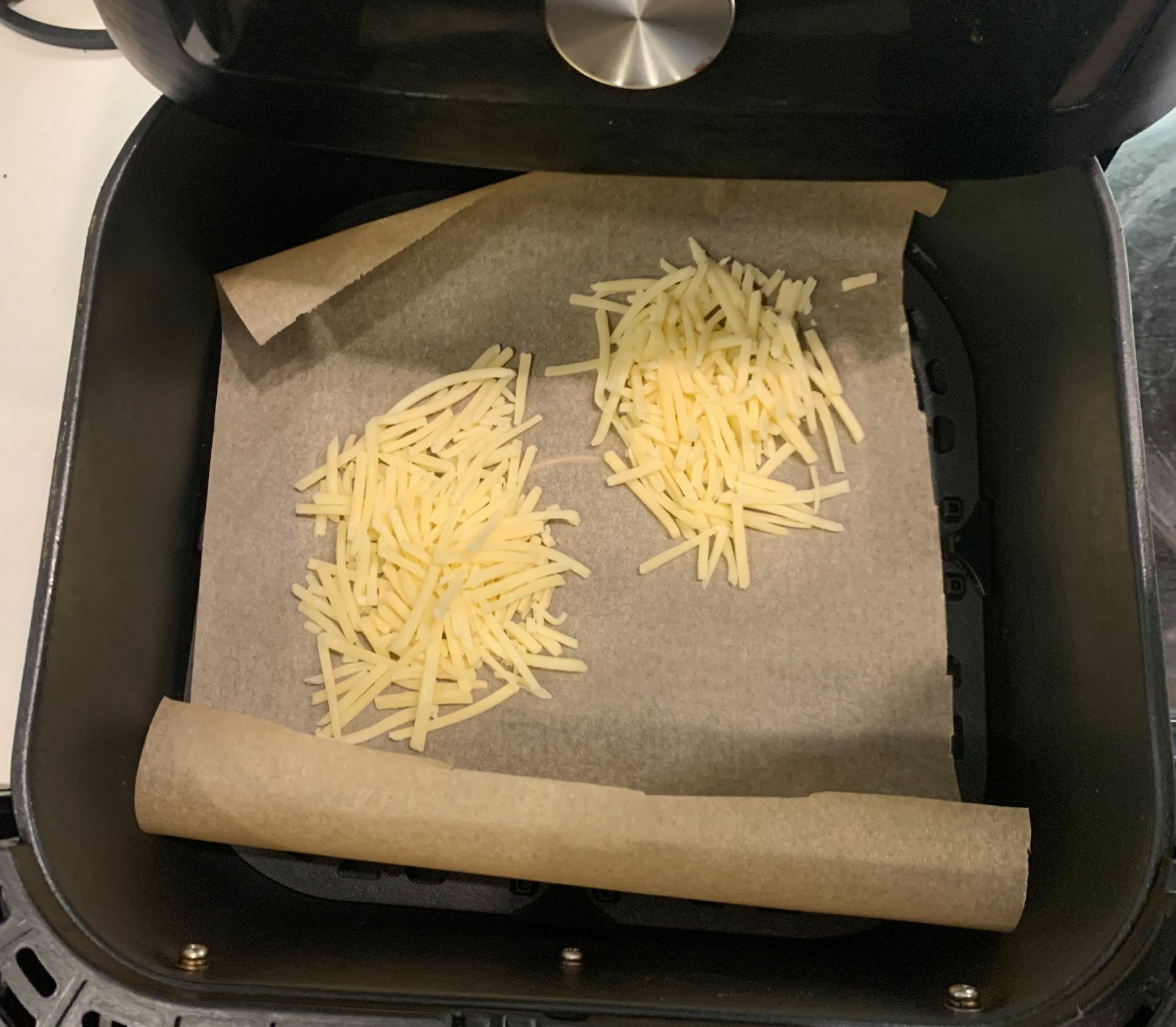 uncooked cheese in air fryer basket