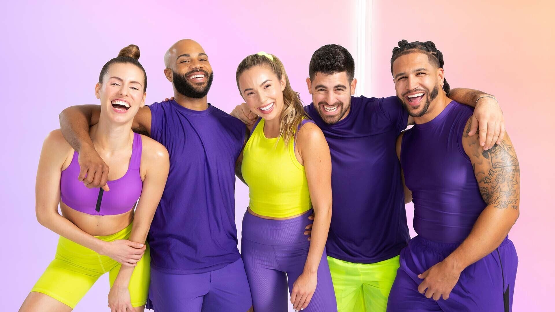 obé fitness instructors posing together as a group