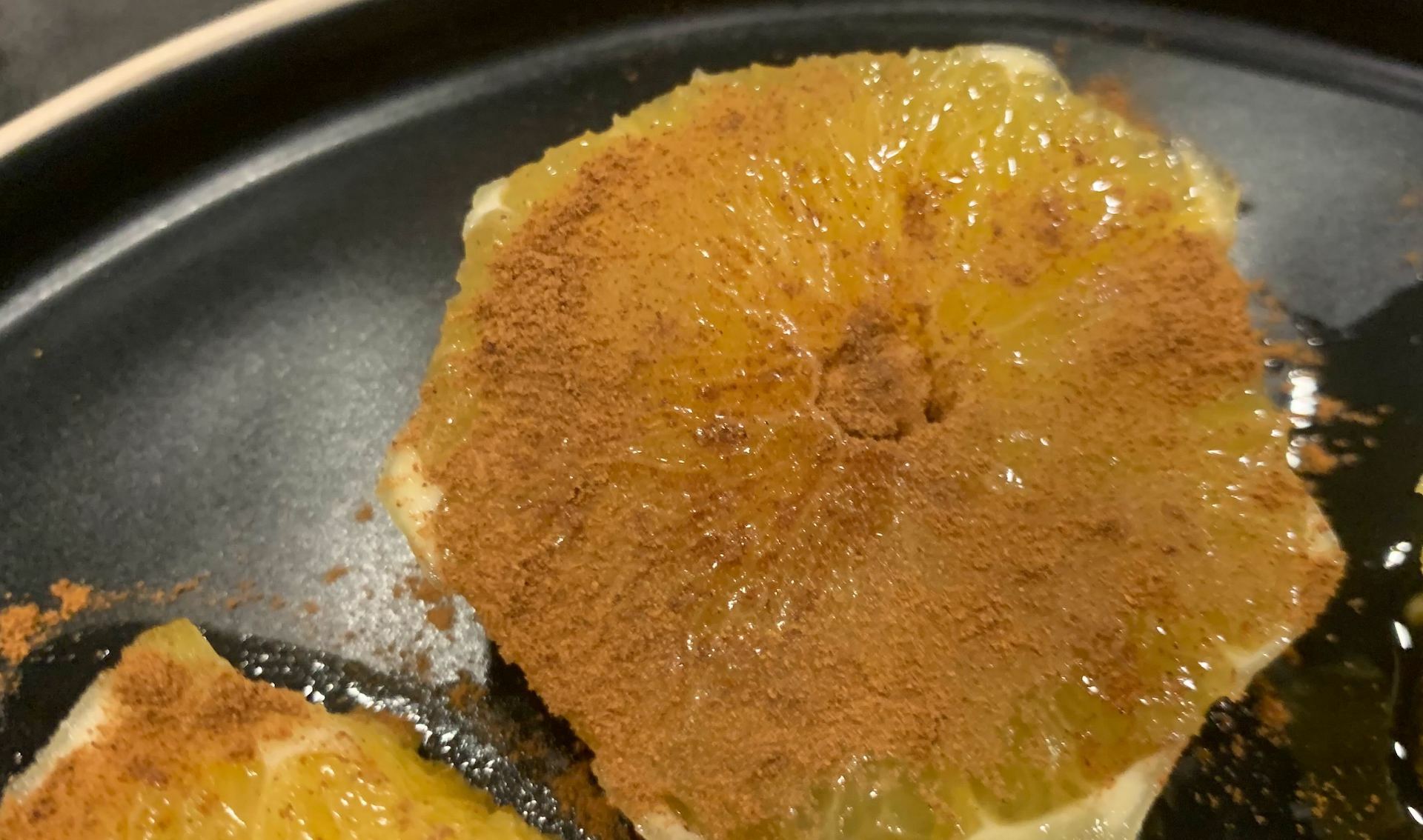 orange sprinkled with cinnamon