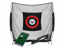 Black target net with golf ball on green mat and sliding tray in front of it
