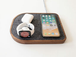 Wooden tray with grey felt surface under iphone, apple watch, and airpods