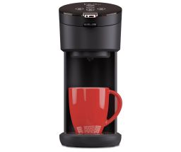 instant solo coffee maker with a red mug on its drip tray
