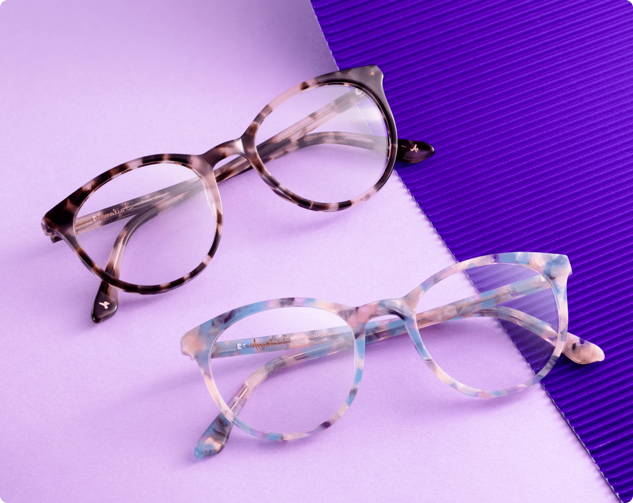 Tortoise shell glasses on purple background