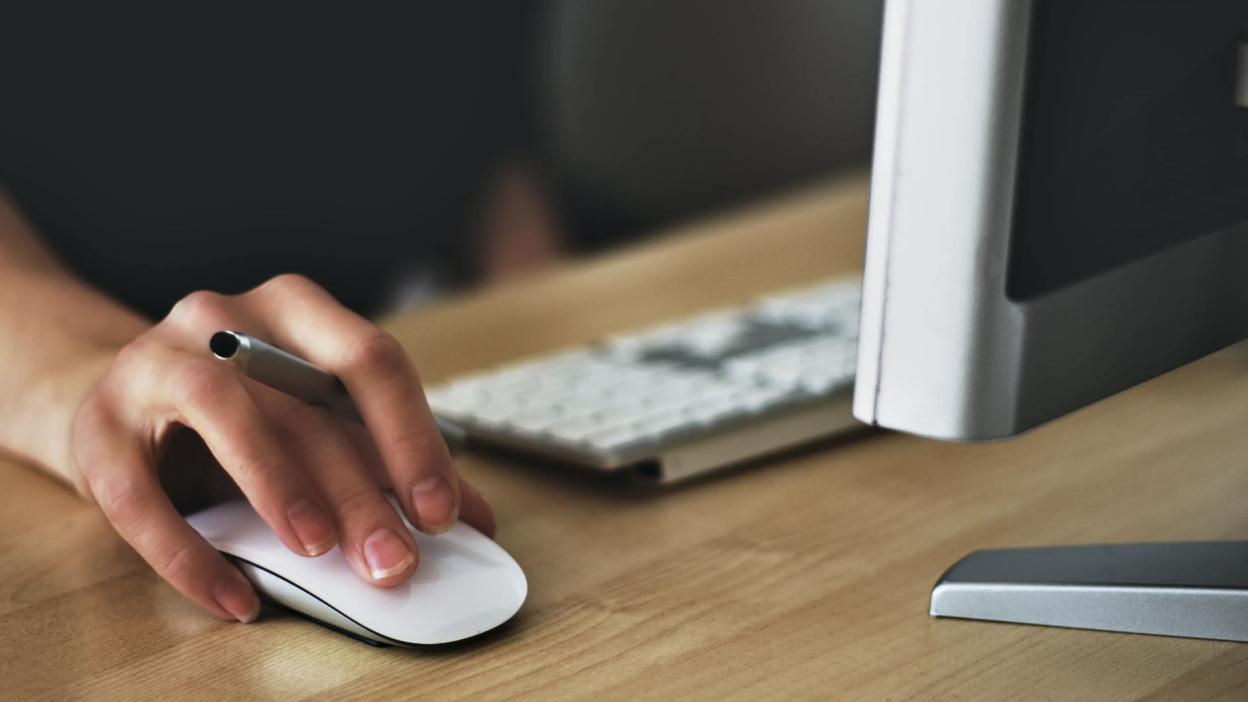 Hand on PC mouse