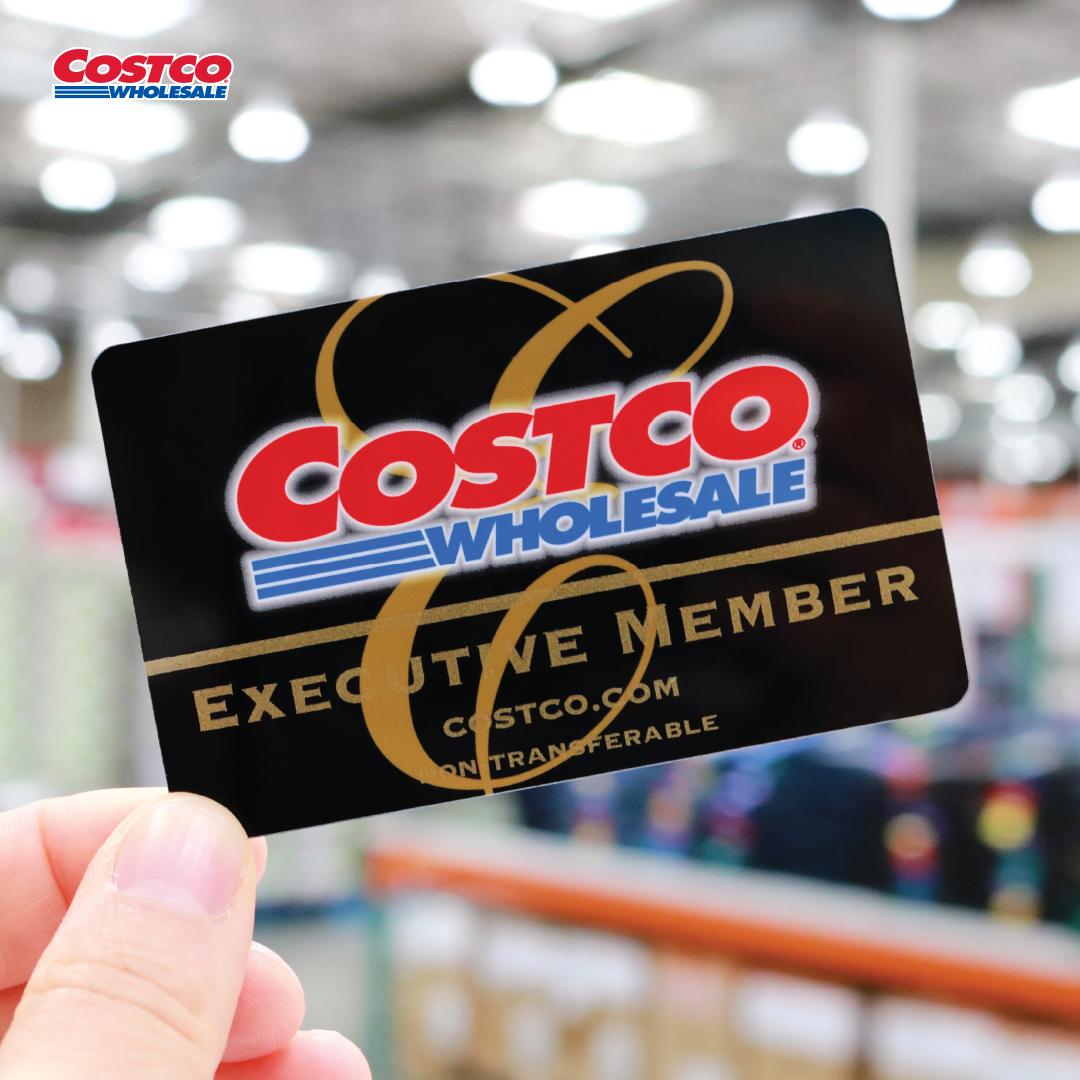 Costco membership card in hand