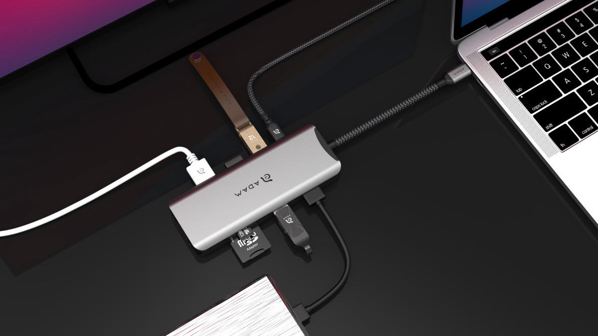 Grey USB hub with nine ports with cords coming out of each