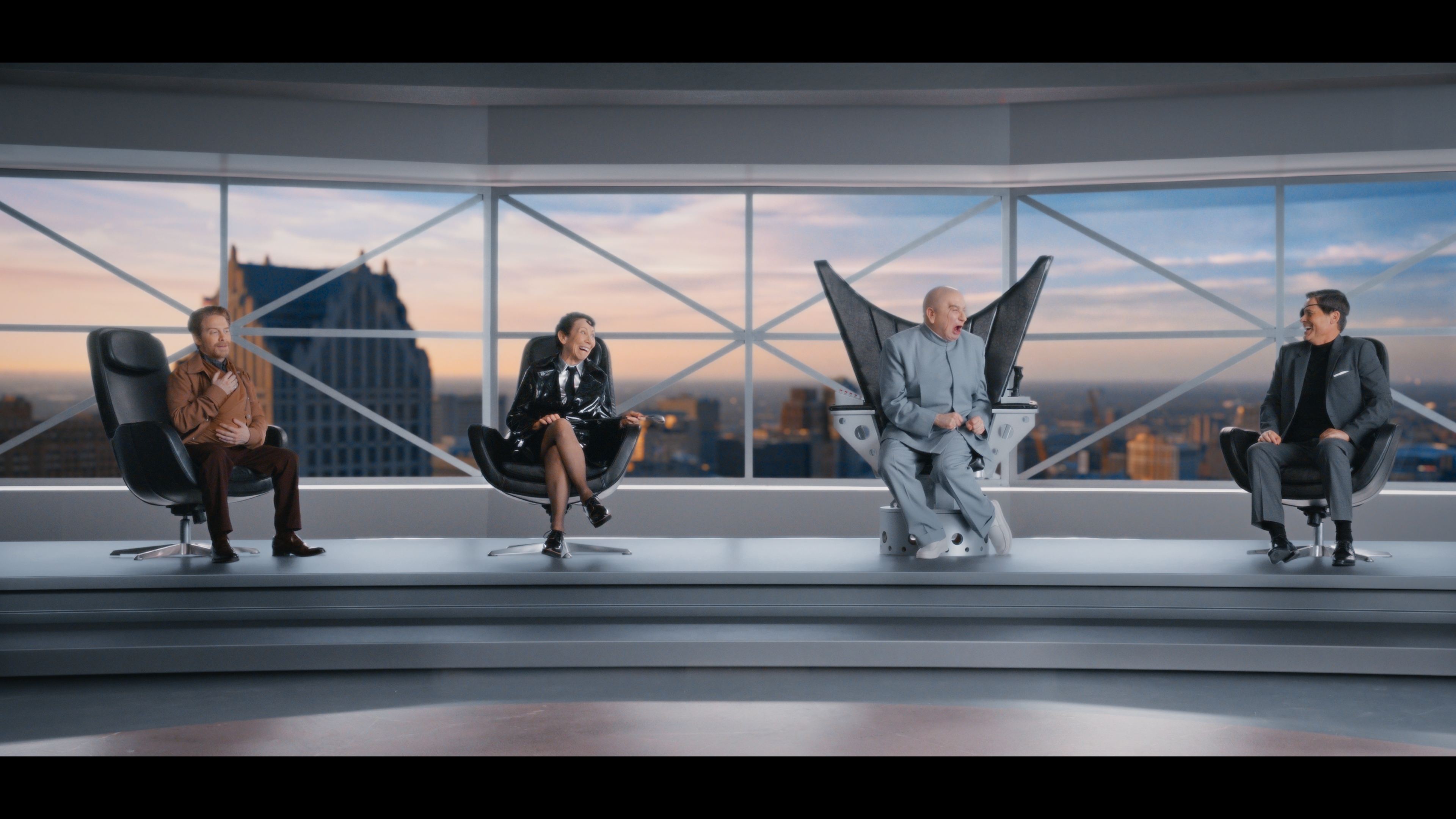 Dr. Evil and his gang seated in a row.
