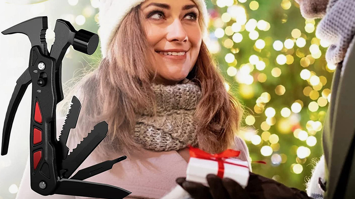 Hand giving person present in white box and red ribbon with picture of black multitool to the side