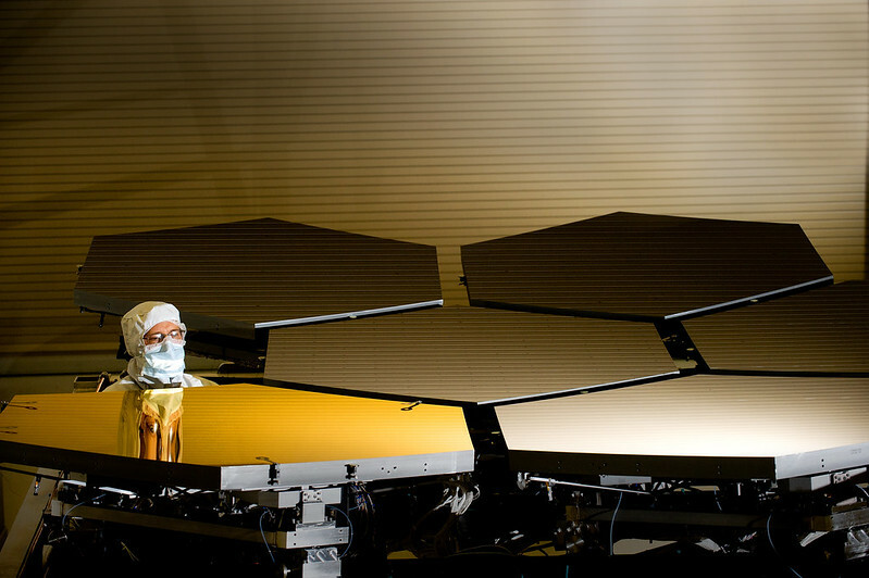 Technician inspecting James Webb Space Telescope mirrors