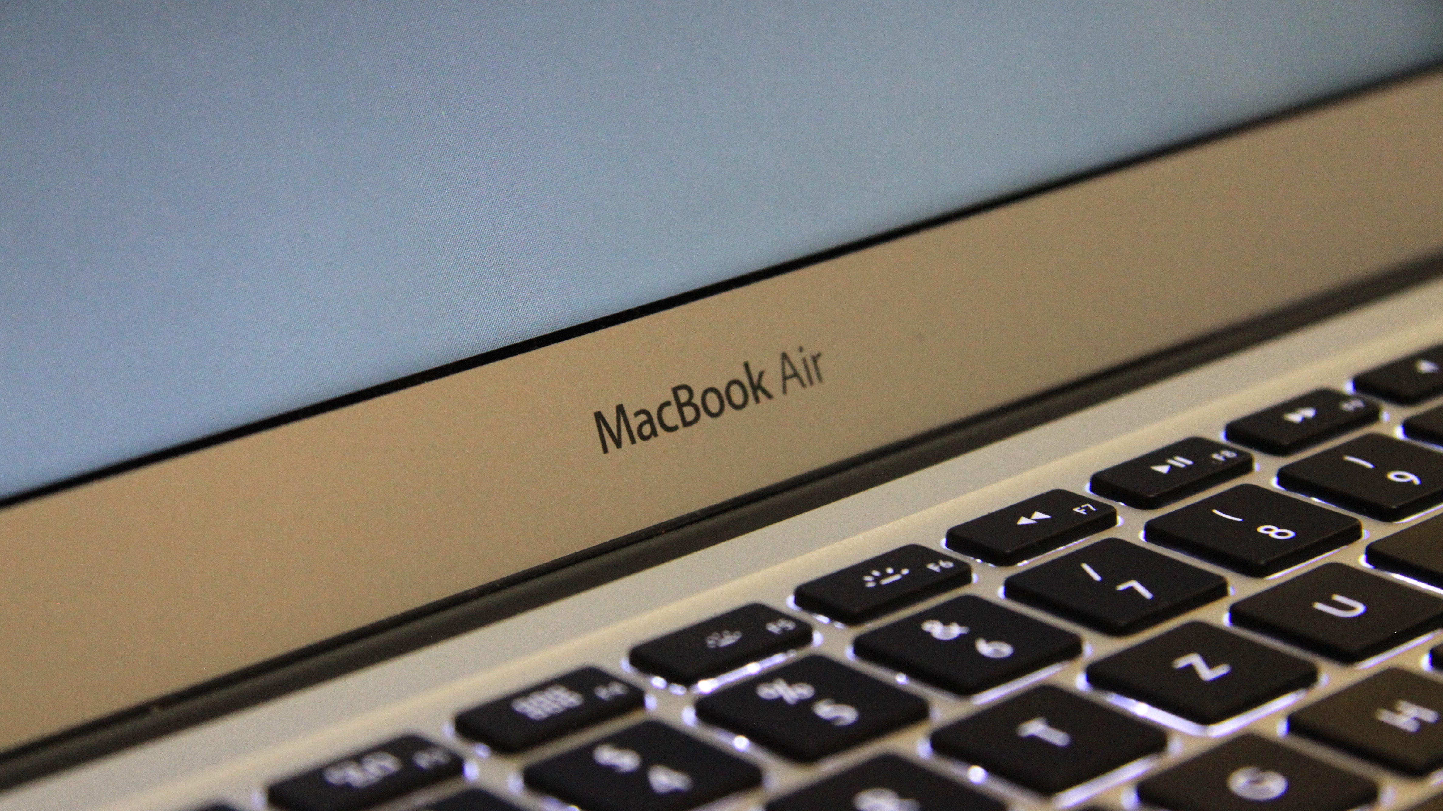 Close-up shot of macbook air logo on device