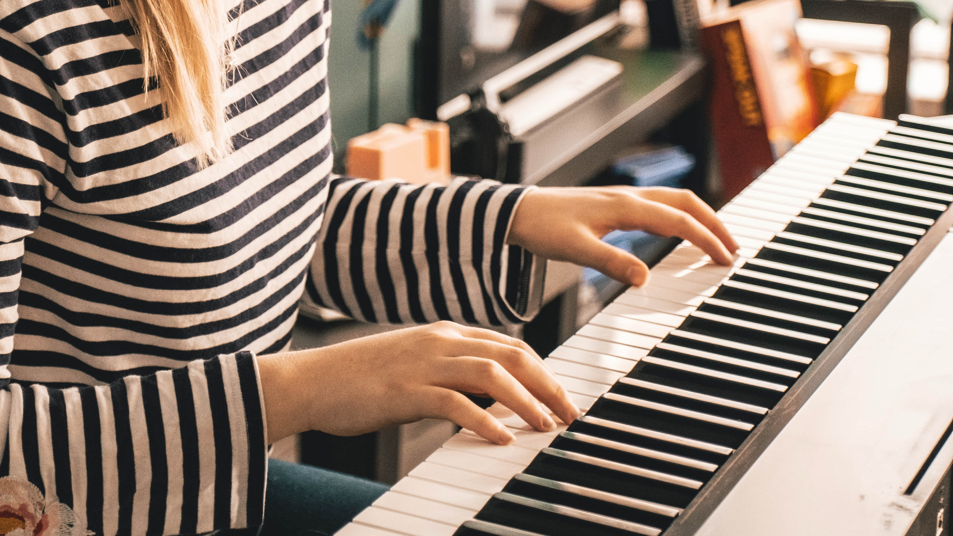 Hands playing on keyboard
