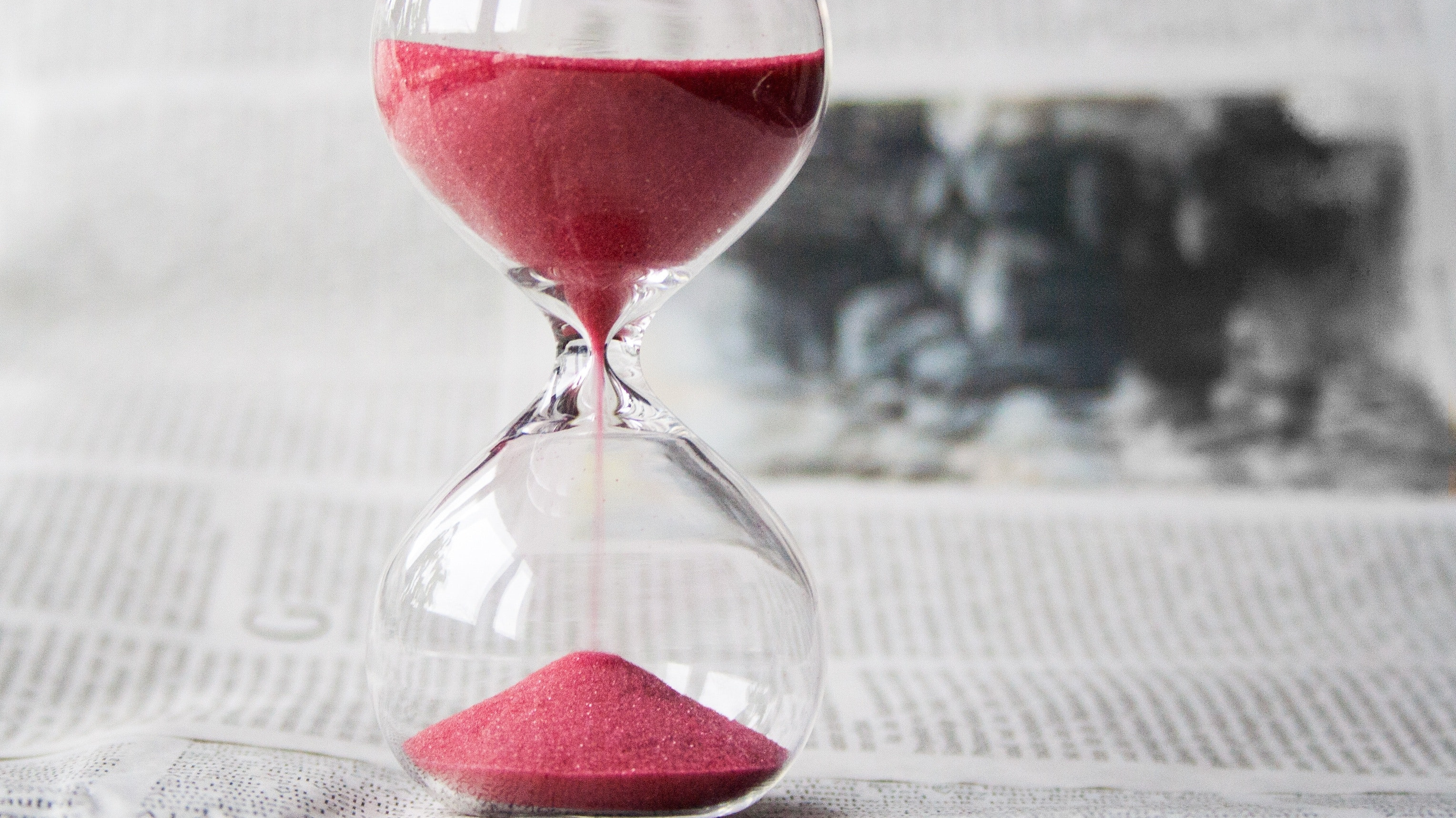 Hourglass with red sand
