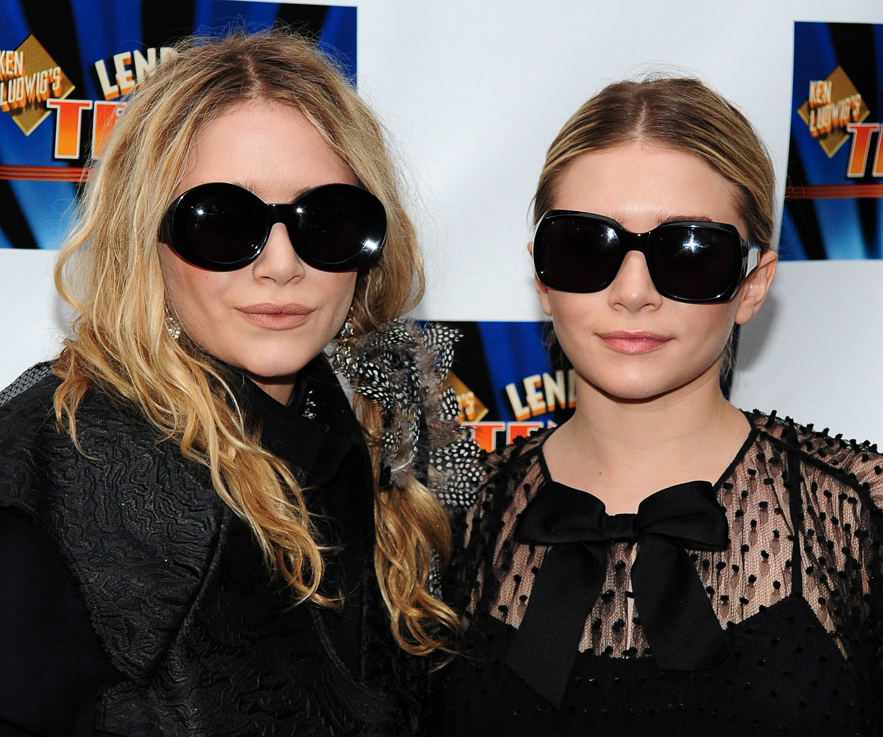 Image of Mary Kate and Ashley Olsen wearing large black sunglasses