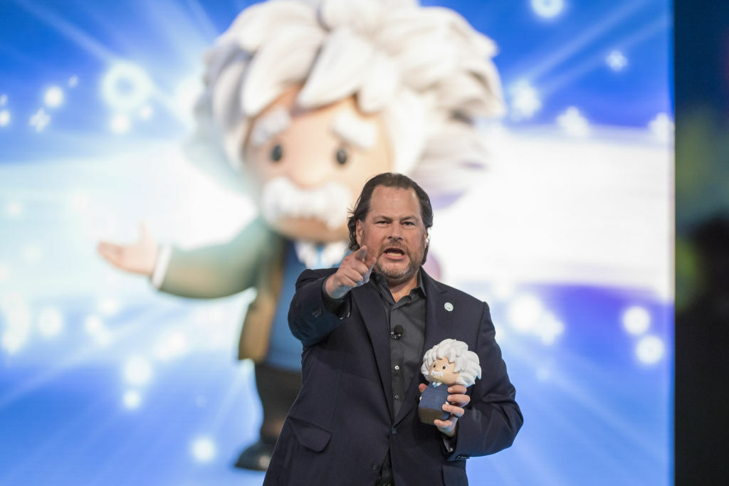 Marc Benioff holds a doll.