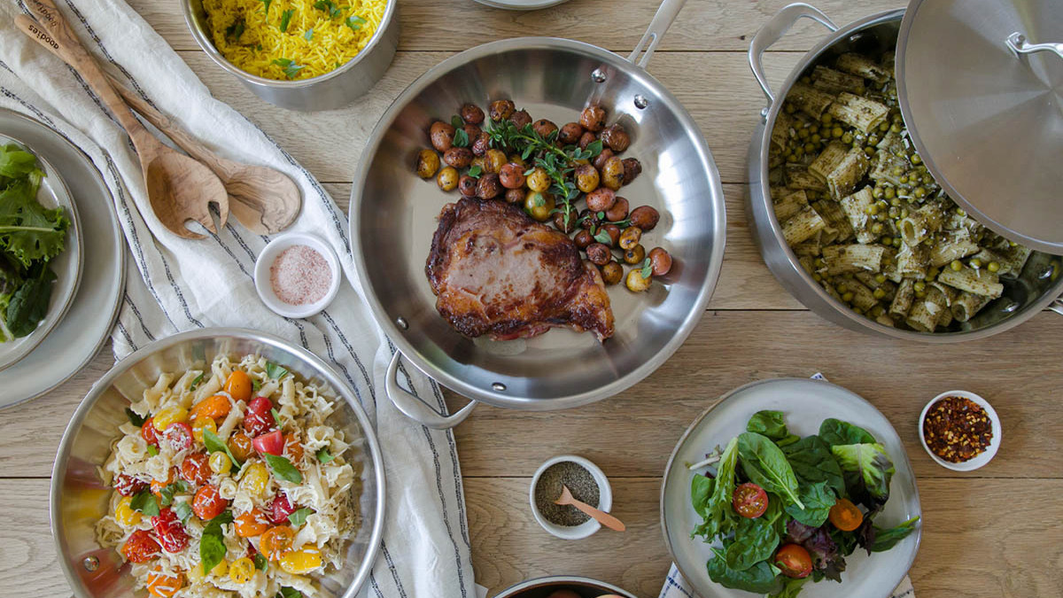 Silver dishes on table containing food