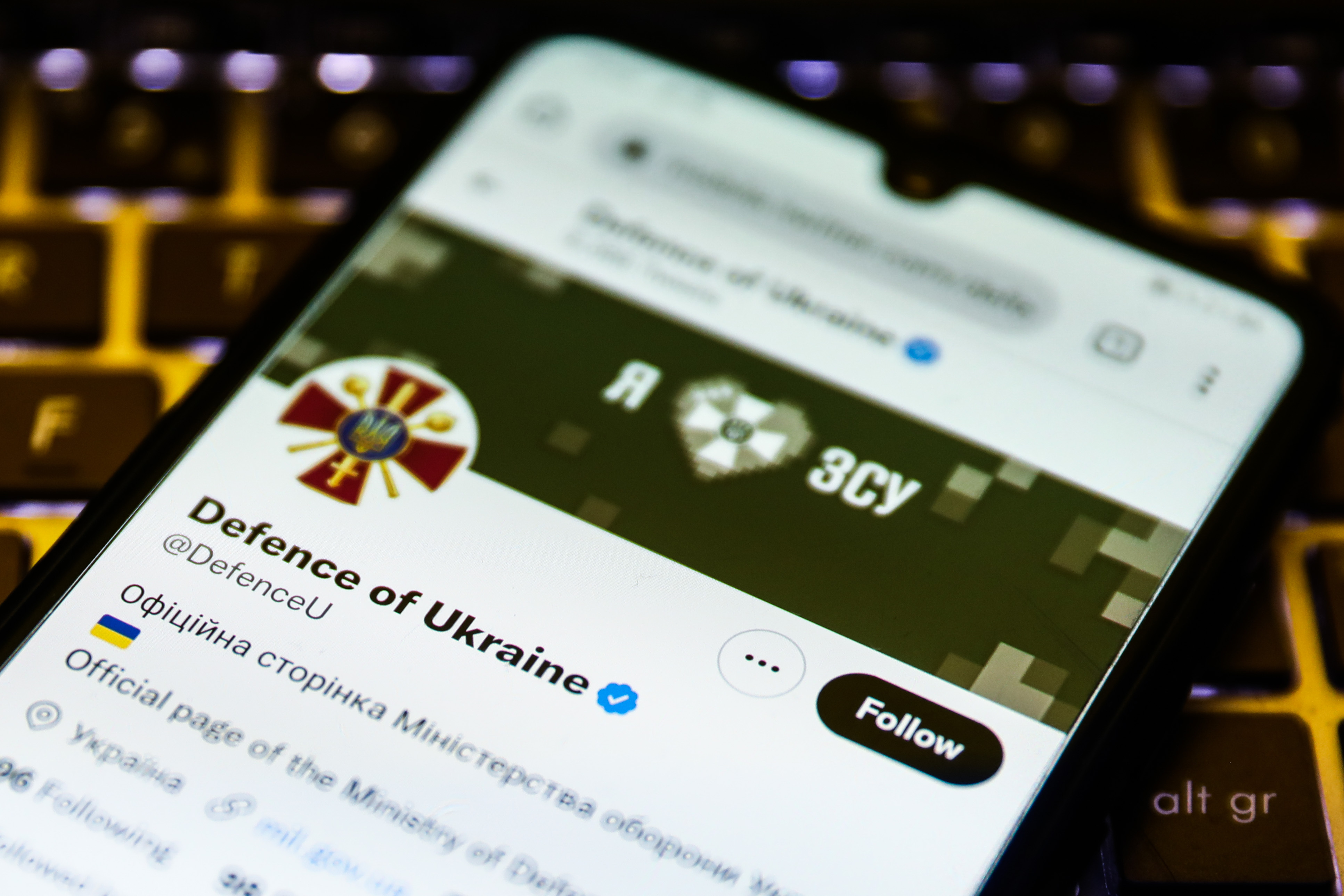 Phone screen showing Defence of Ukraine's Twitter account page