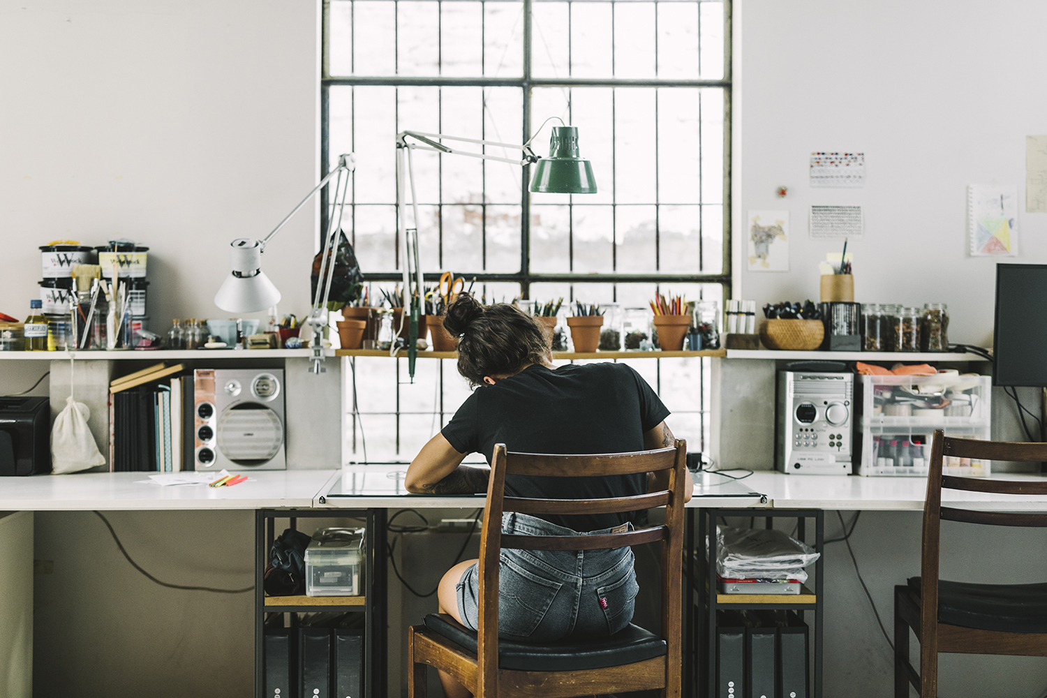 A woman sitting at her desk working.