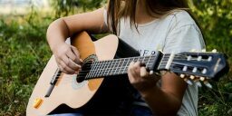 Person playing guitar