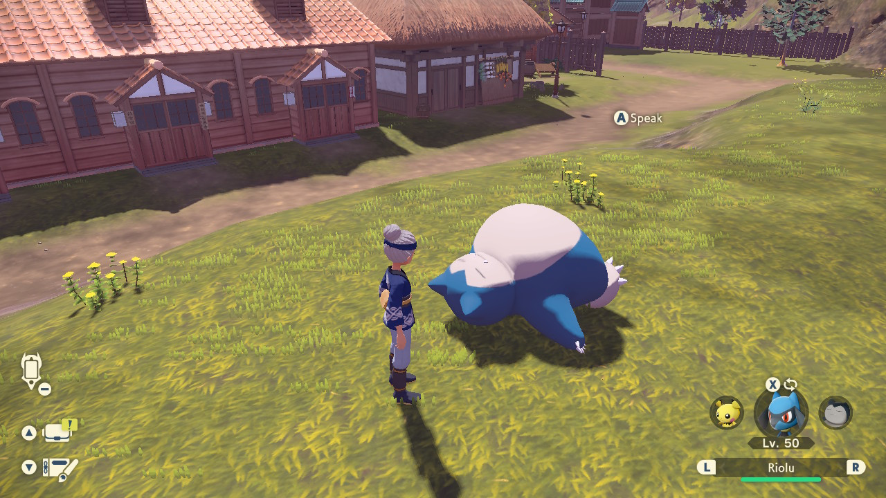 A Snorlax sleeping on the ground in "Pokémon Legends: Arceus"