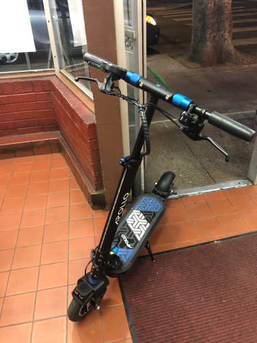 A scooter in a doorway.