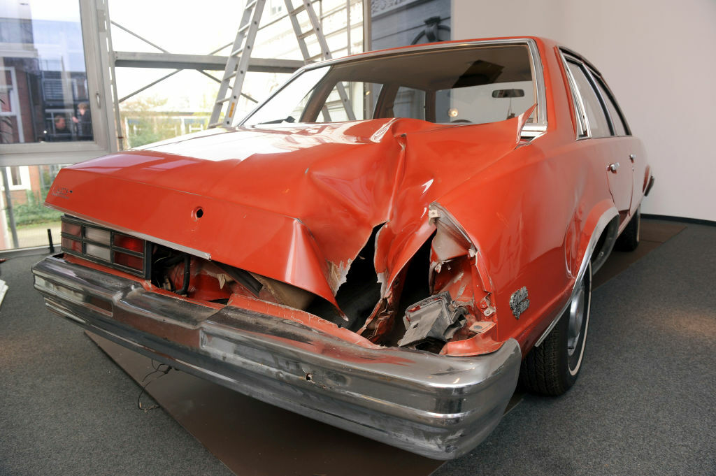 exhibit displaying a Chevy Malibu impacted by a meteorite