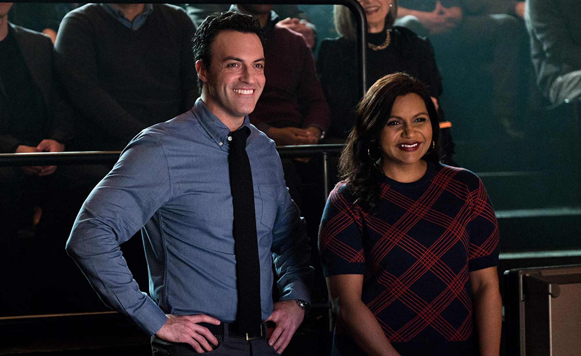Reid Scott and Mindy Kaling laughing in a still from Late Night.