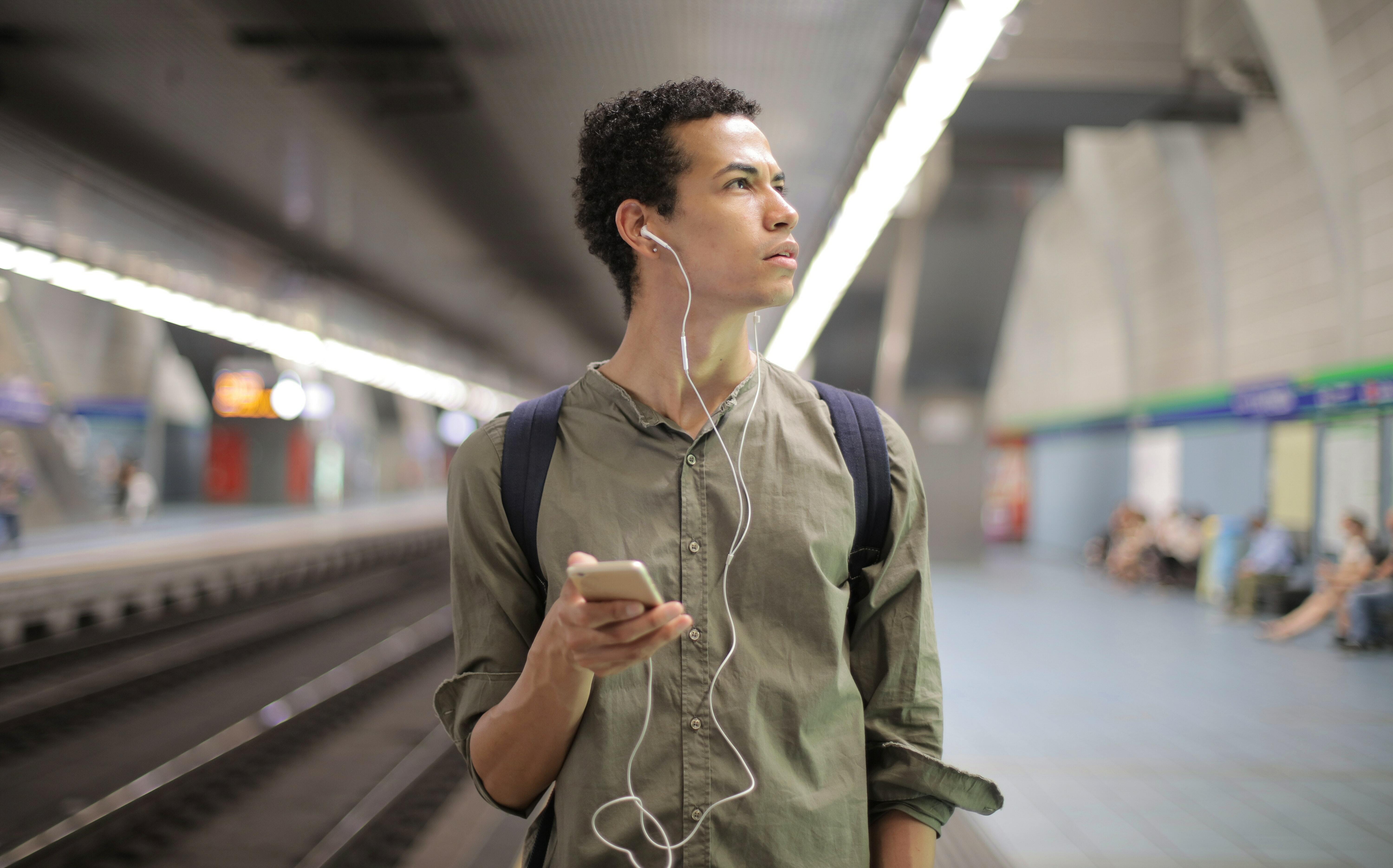 Man with headphones and phone