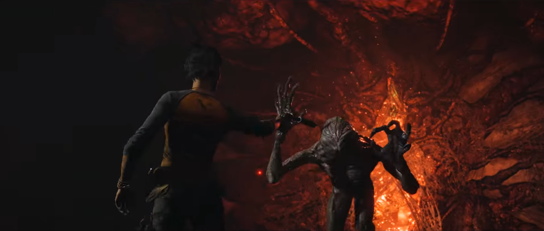 A screenshot from the Far Cry 6 x Stranger Things crossover. Dani Rojas is aiming her handgun at the head of a Demogorgon.