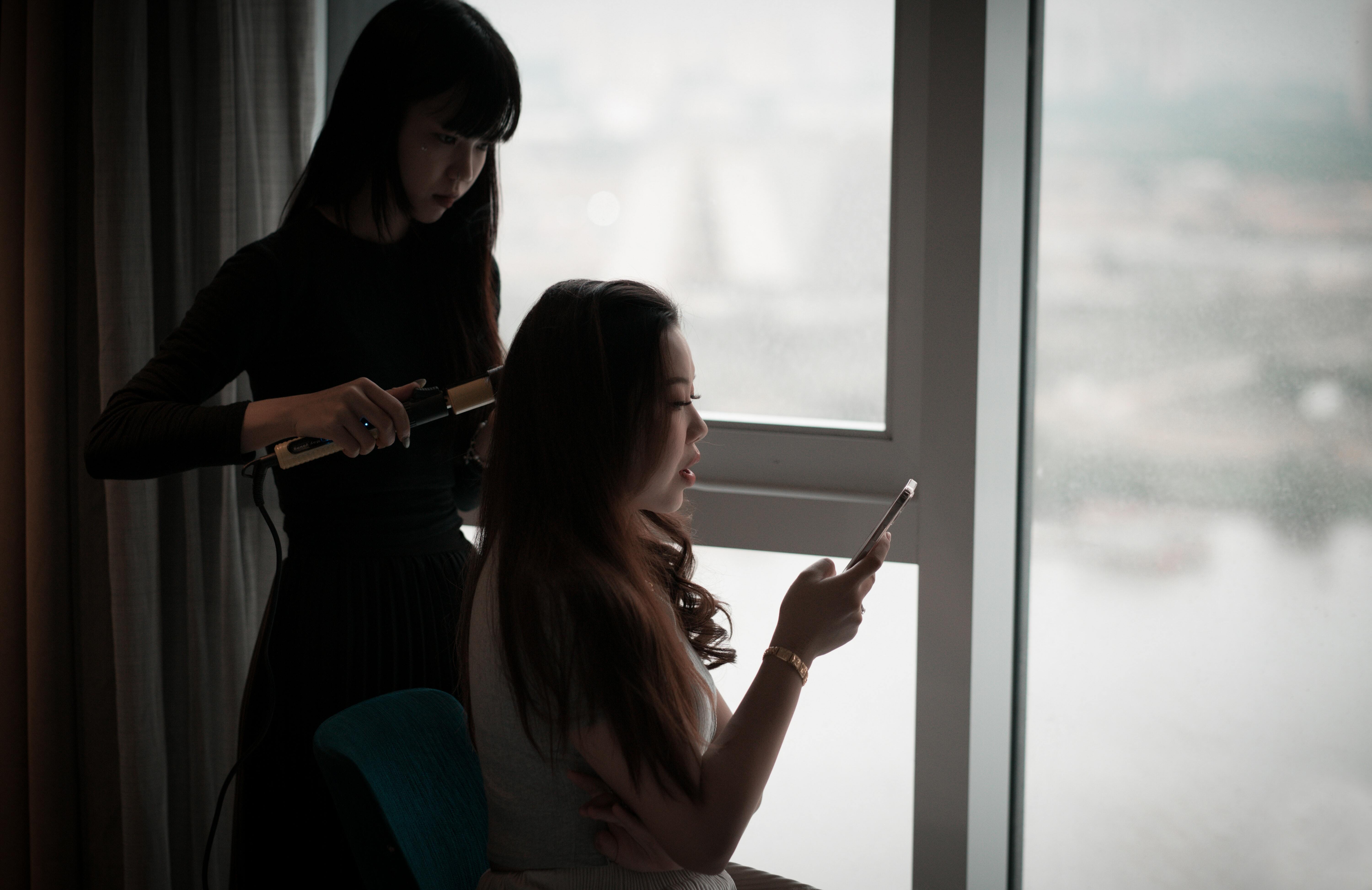 Person having their hair styled