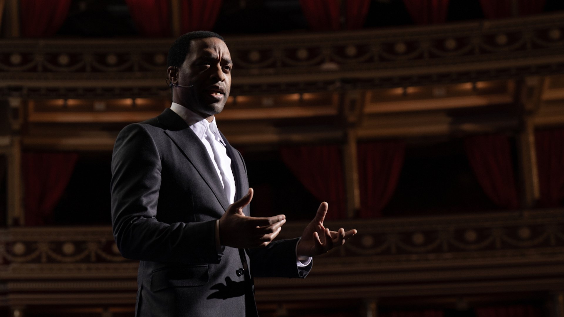 Chiwetel Ejiofor delivering a speech in a still from 