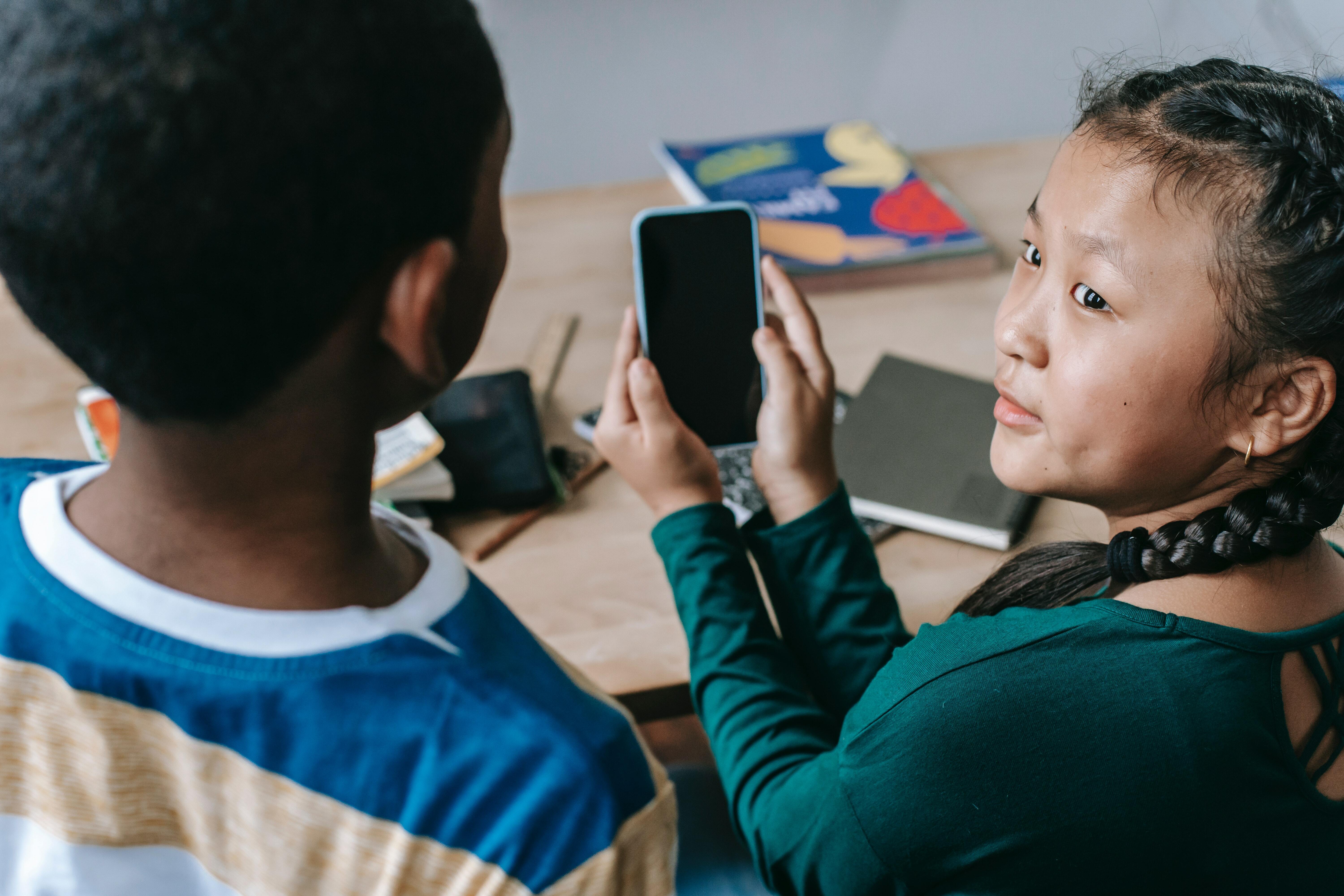 Two kids with phone