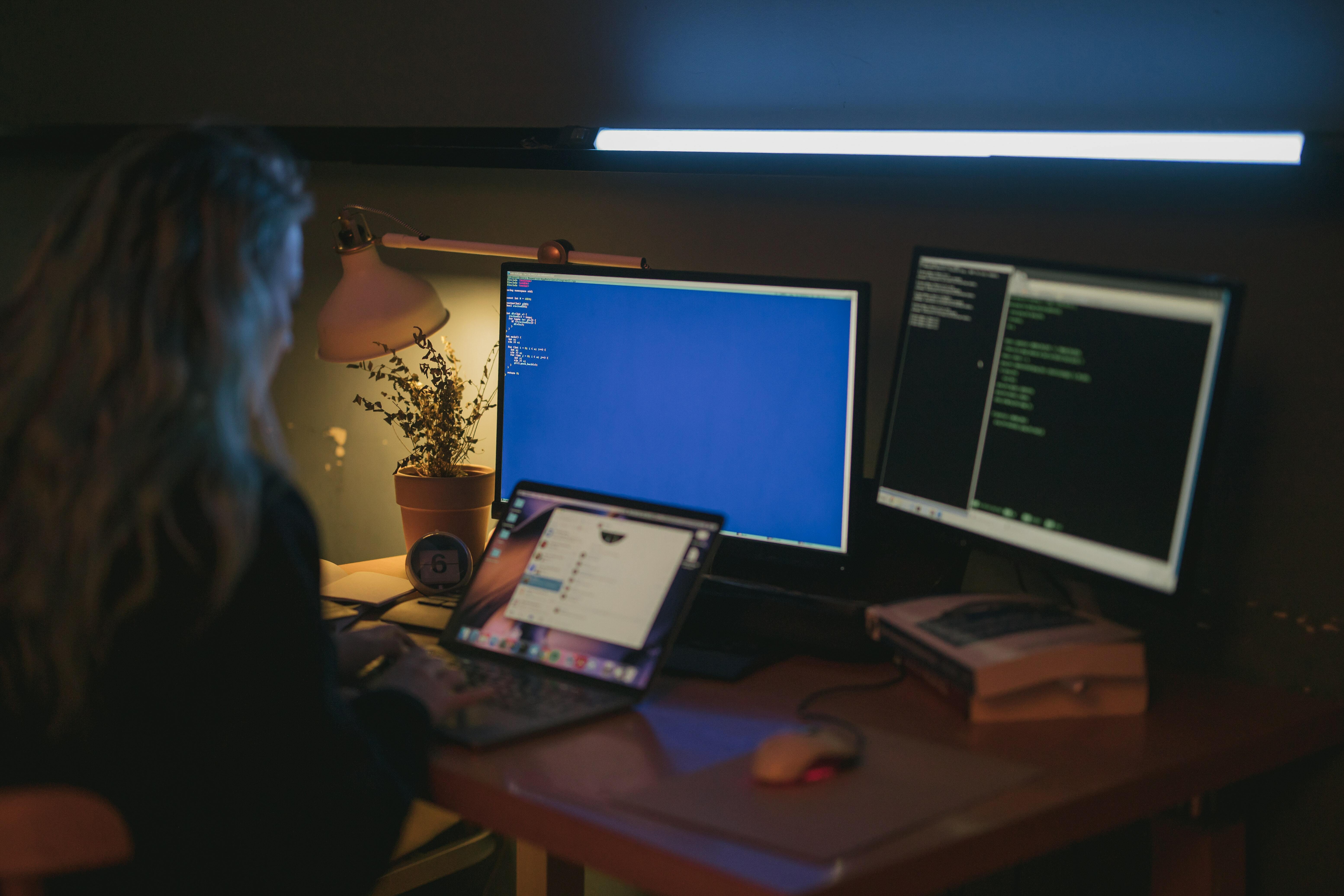 Person staring at multiple screens