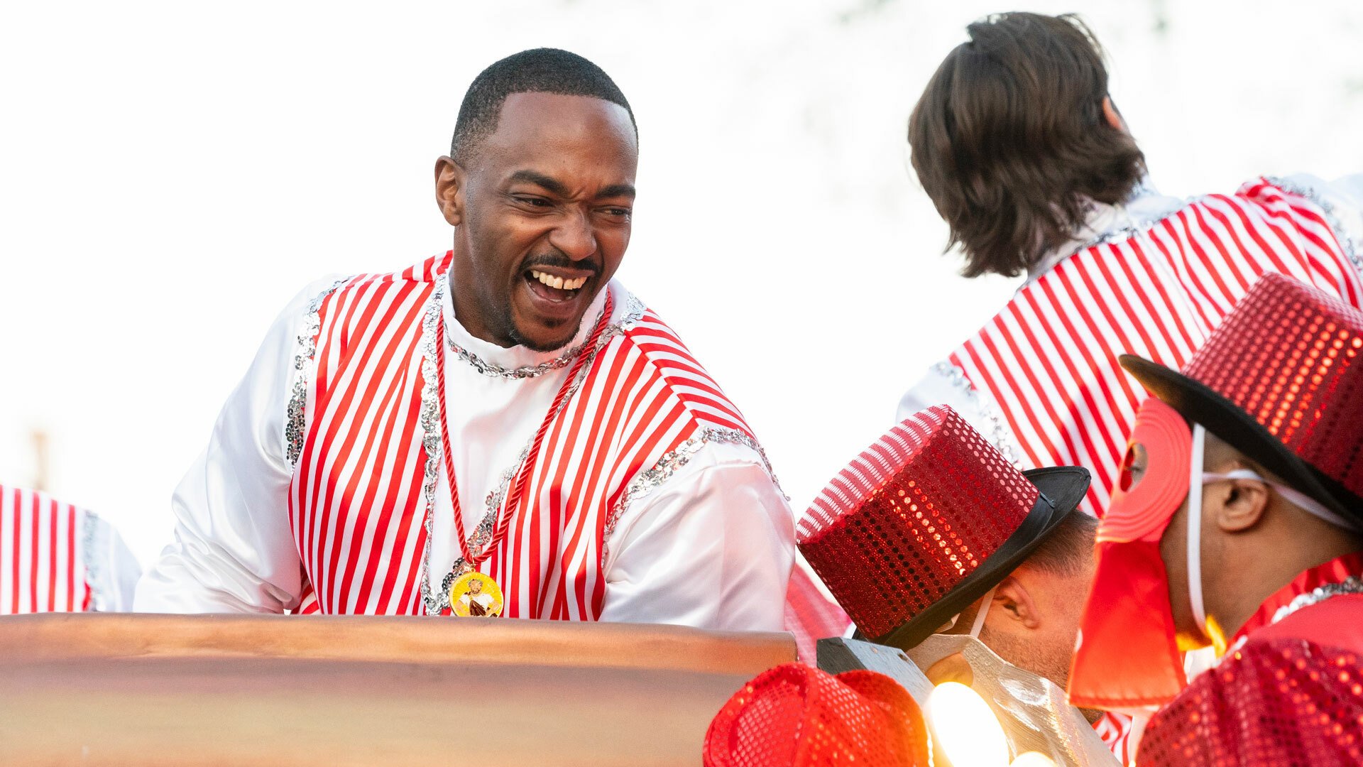 Anthony Mackie dressed in a colorful outfit at Mardi Gras 2022.