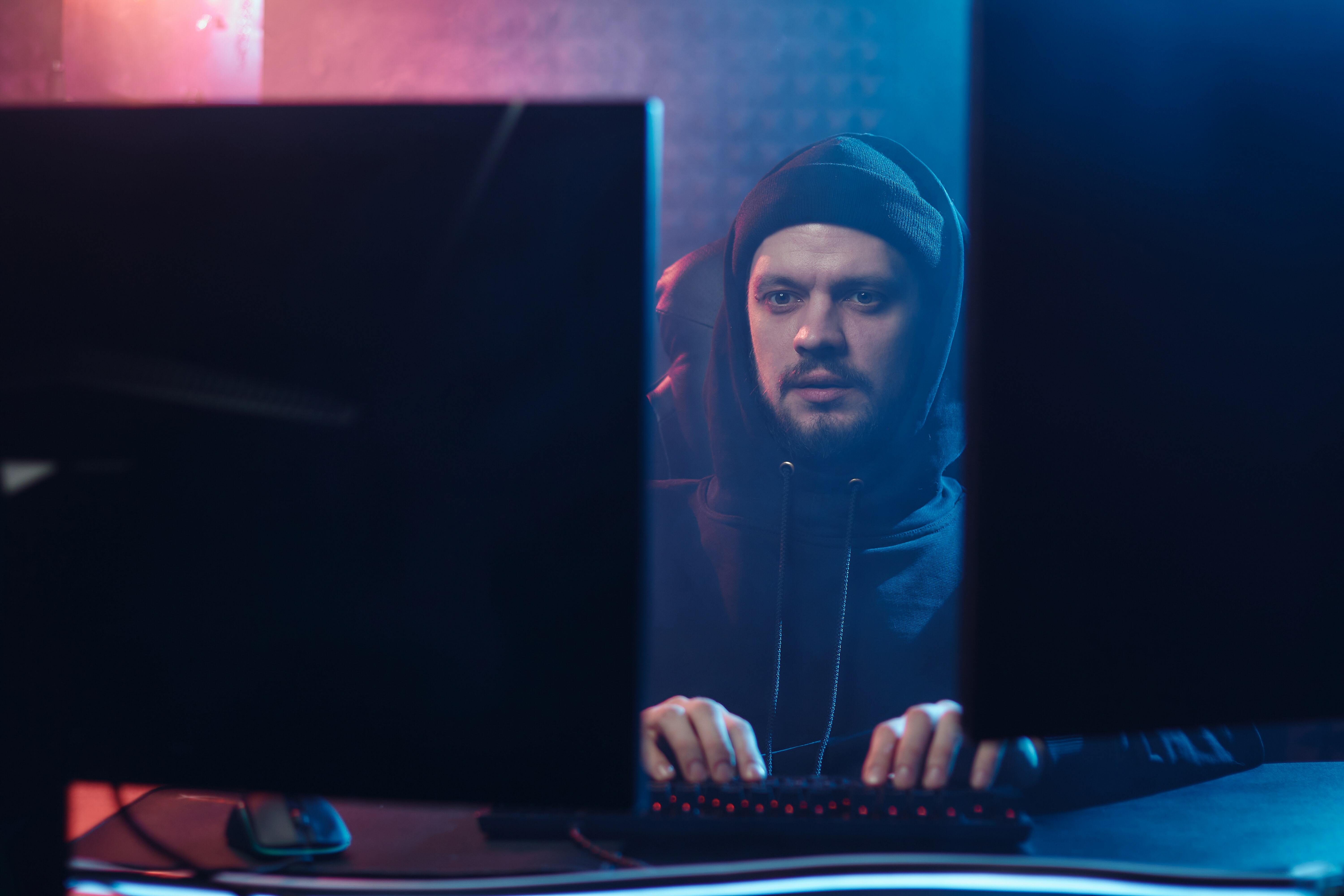 Man looking at screens