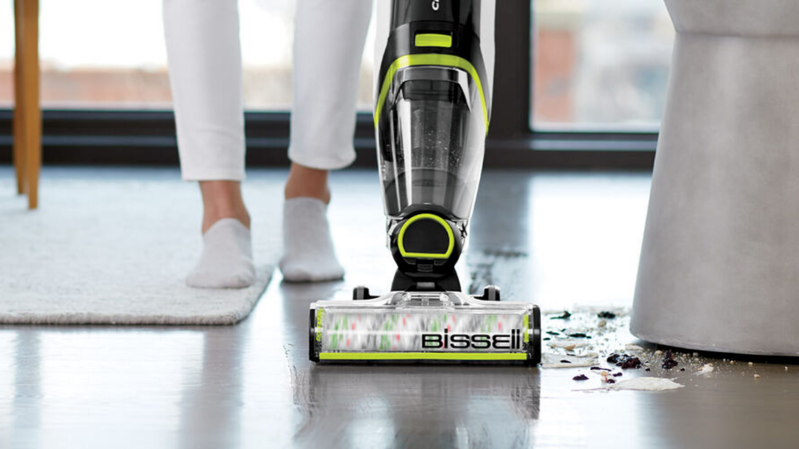 woman cleaning floors with bissell crosswave cordless max pet