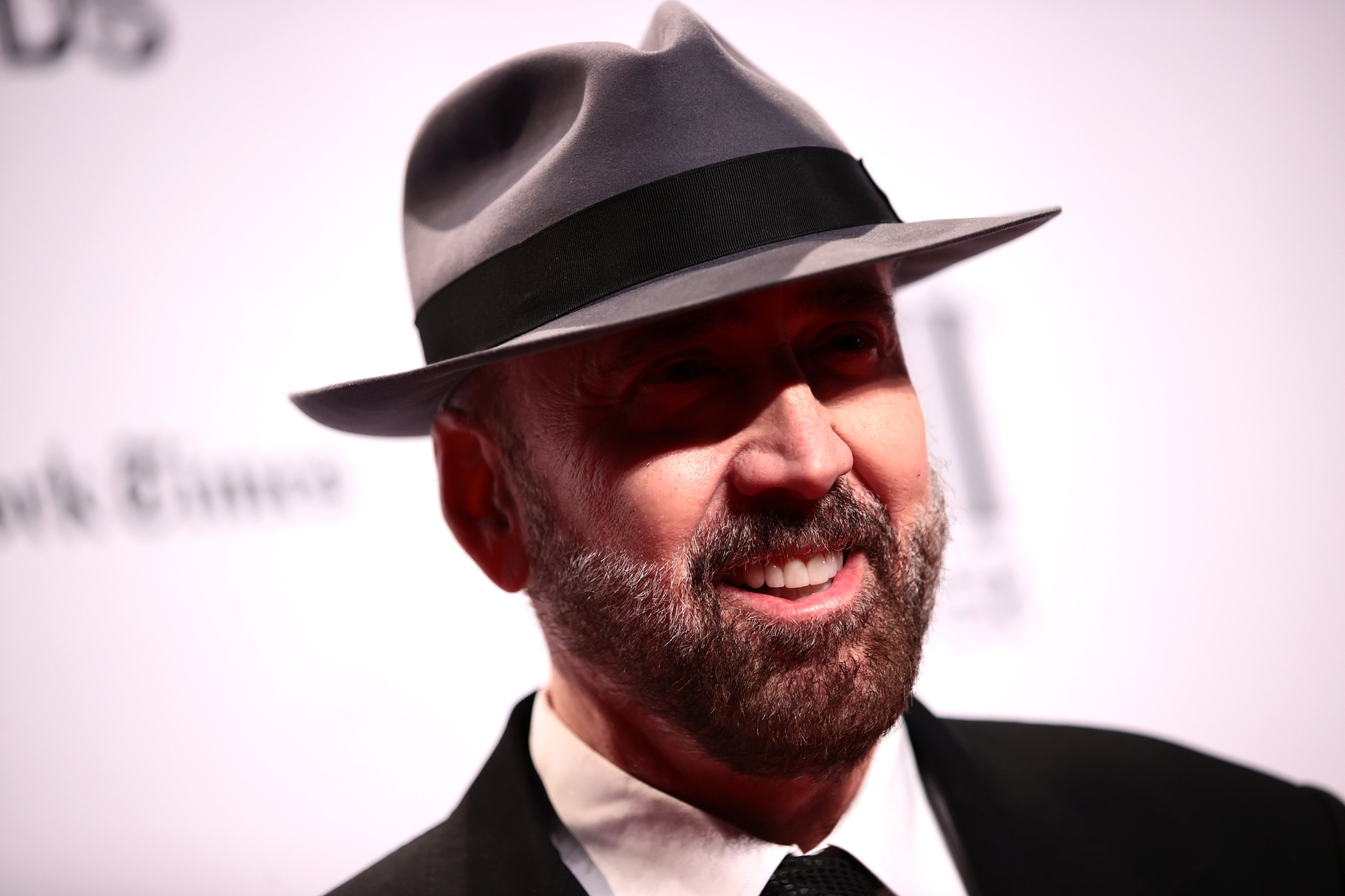 Close up of Nicolas Cage at a red carpet.