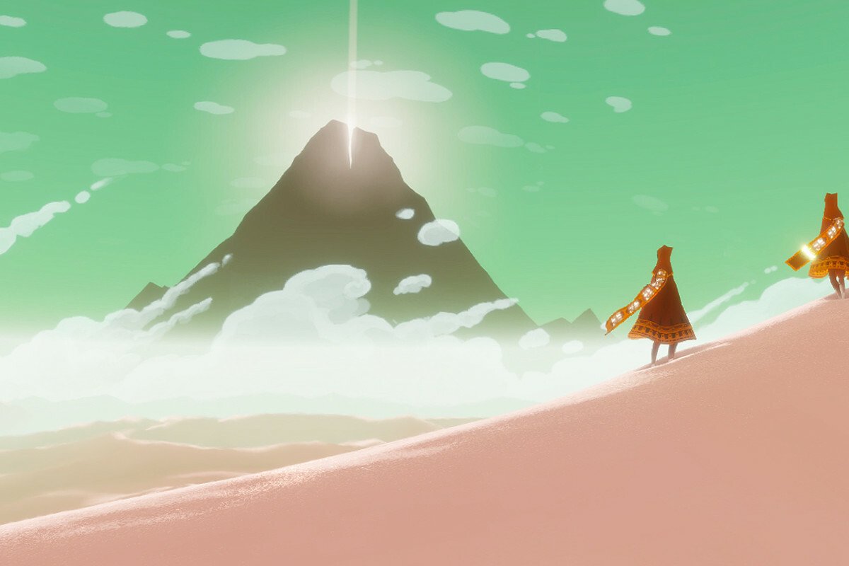 Two cloaked players stare upon the mountain they must climb in the 2013 'Journey' videogame