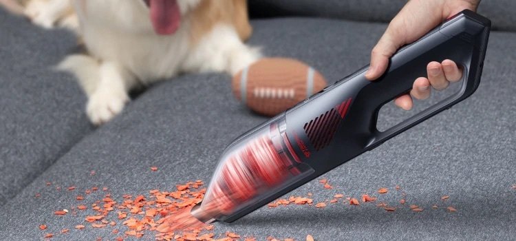 Image of Eufy HomeVac H30 Venture vacuuming up a pile of crumbs
