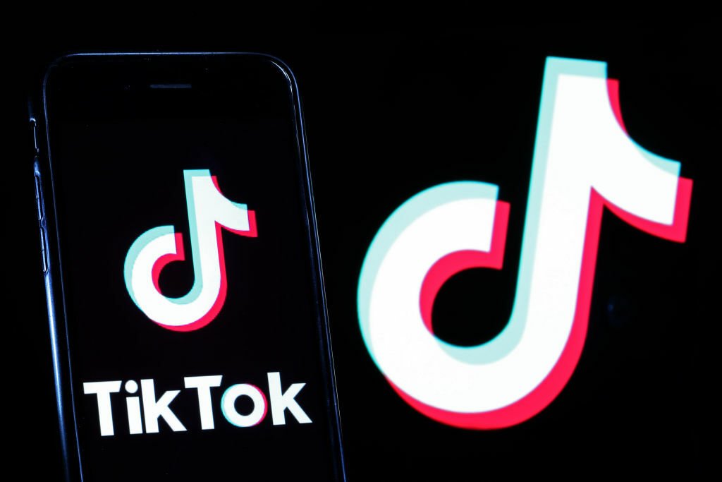 The TikTok logo on a smartphone.