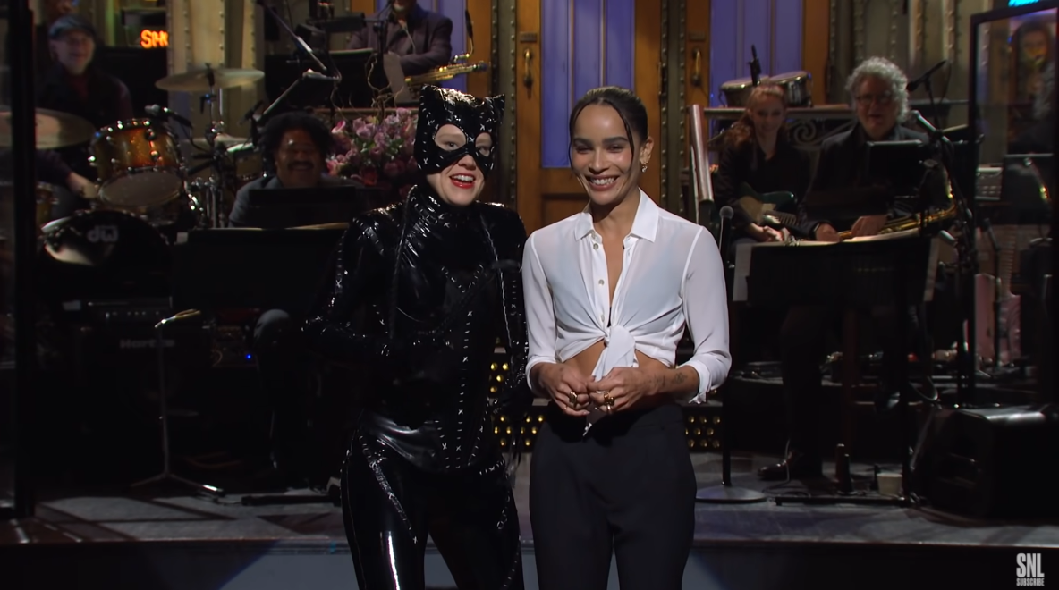 Kate McKinnon dressed like Michelle Pfeiffer's Catwoman from 