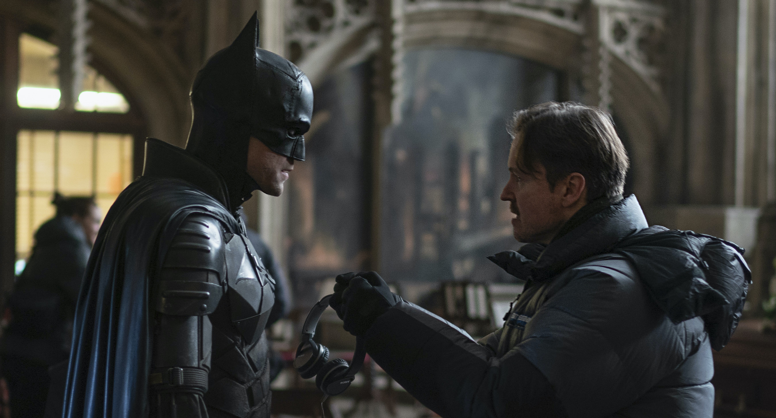 Director Matt Reeves behind-the-scenes with actor Robert Pattinson as Batman.