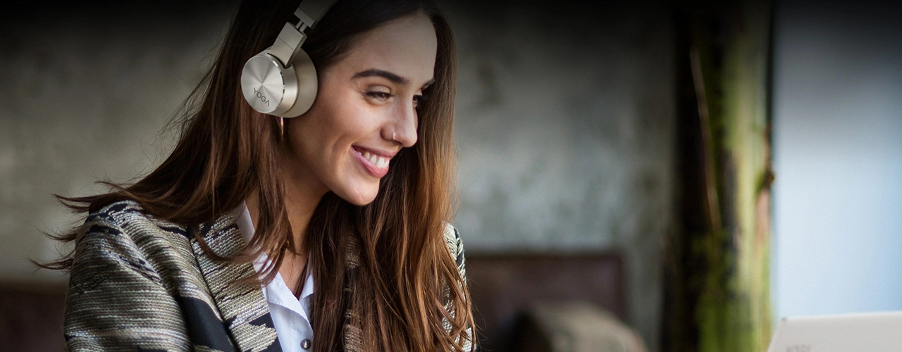 Woman wearing YOGA headphones and smiling