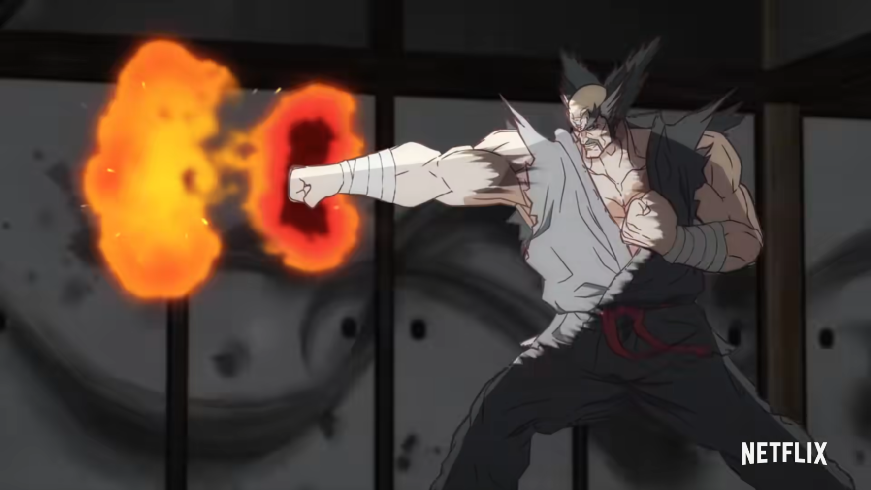 An anime version of the Tekken character Heihachi Mishima is shown mid-punch, with an explosive burst emanating from his extended fist.