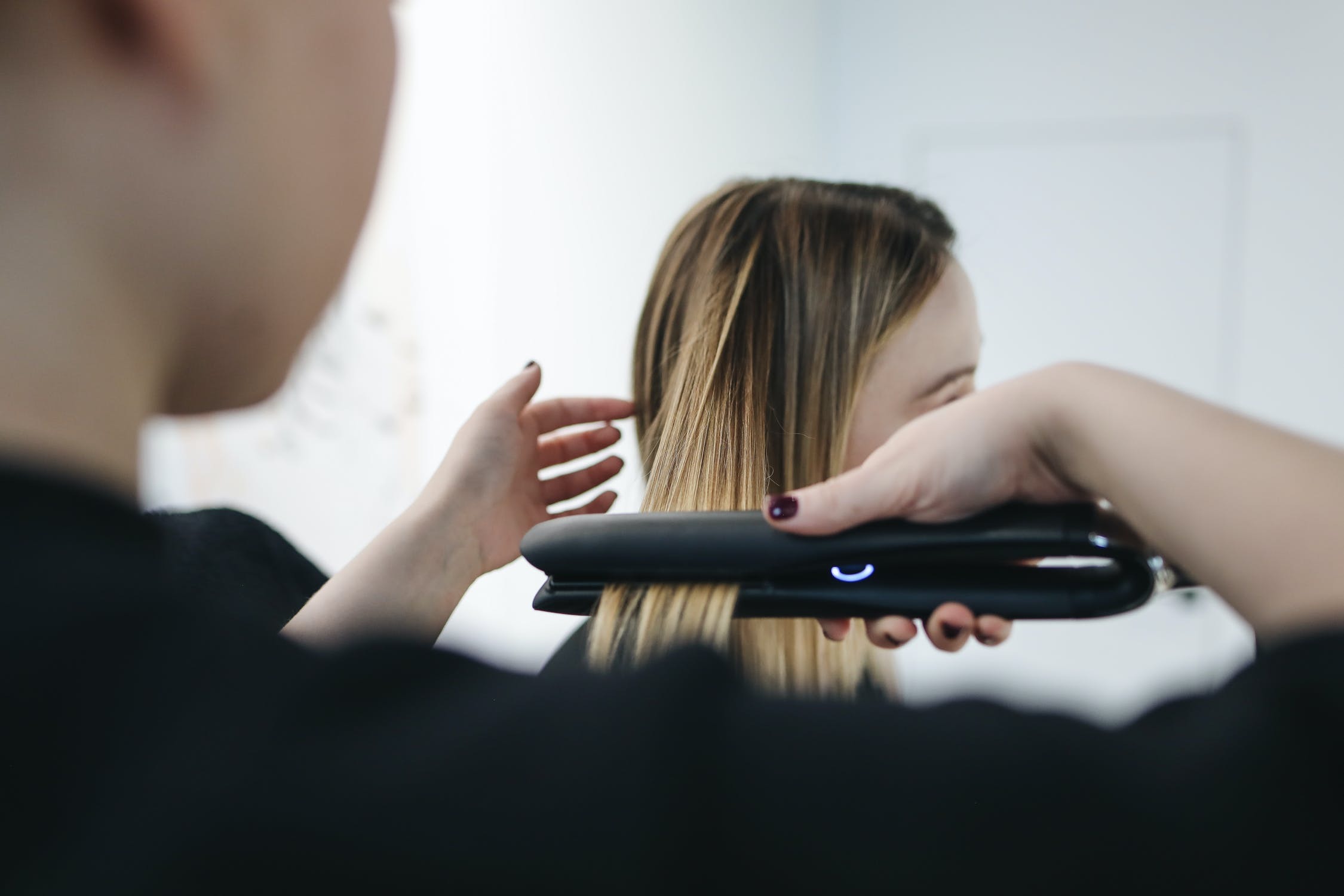 Stylist using flat iron