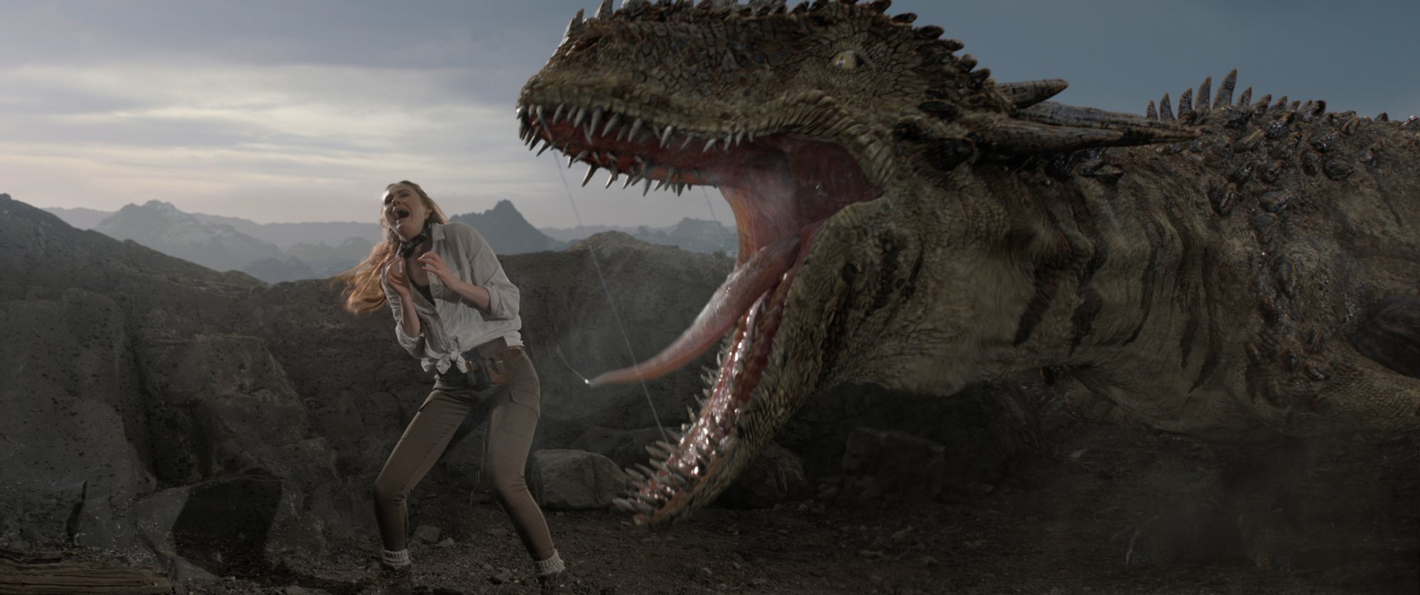 A woman screaming next to a large dinosaur with its jaws wide open.