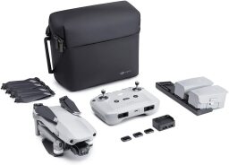 Drone and accessories kit with controller, lens filters, batteries, extra propellers, and bag