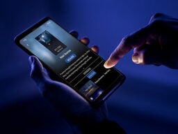 Hands holding phone on restflix screen