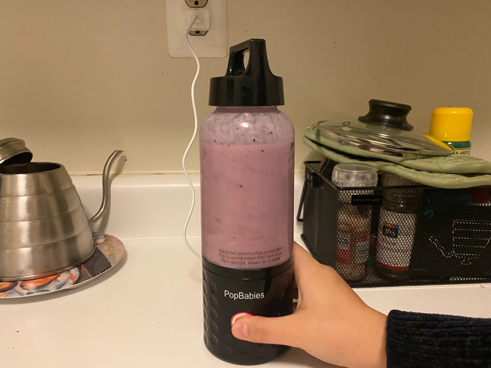 smoothie blending inside small personal blender