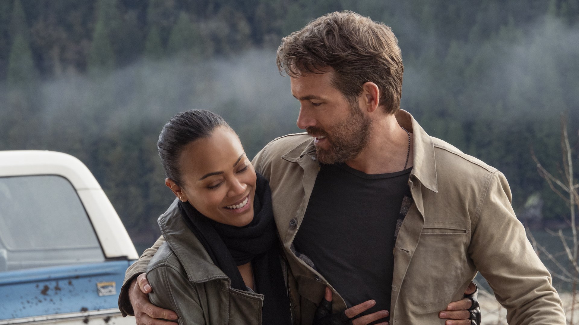 Zoe Saldana as Laura and Ryan Reynolds as Big Adam hugging in the Netflix film "The Adam Project."